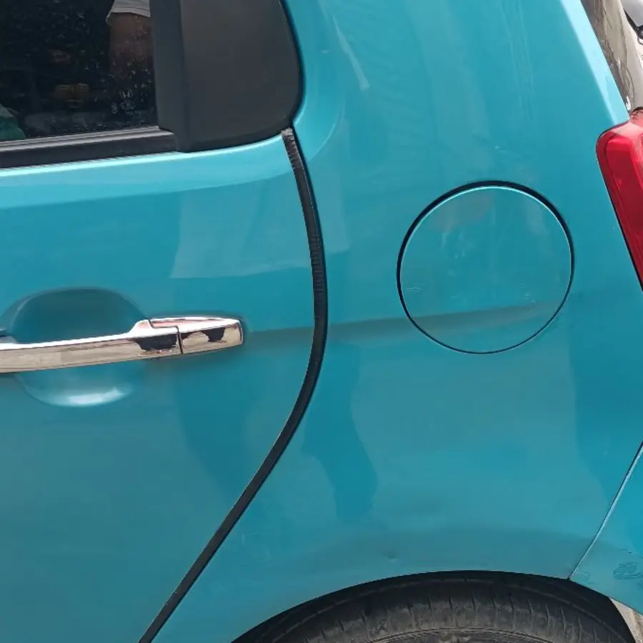 Dent on a car’s rear quarter panel